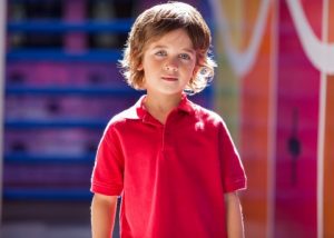 a boy in red shirt