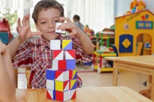 A child stacking blocks