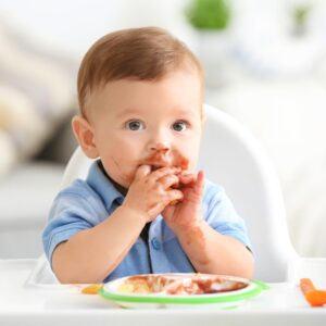 image of a infant eating