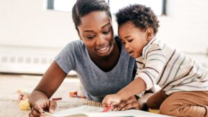 mother playing with toddler