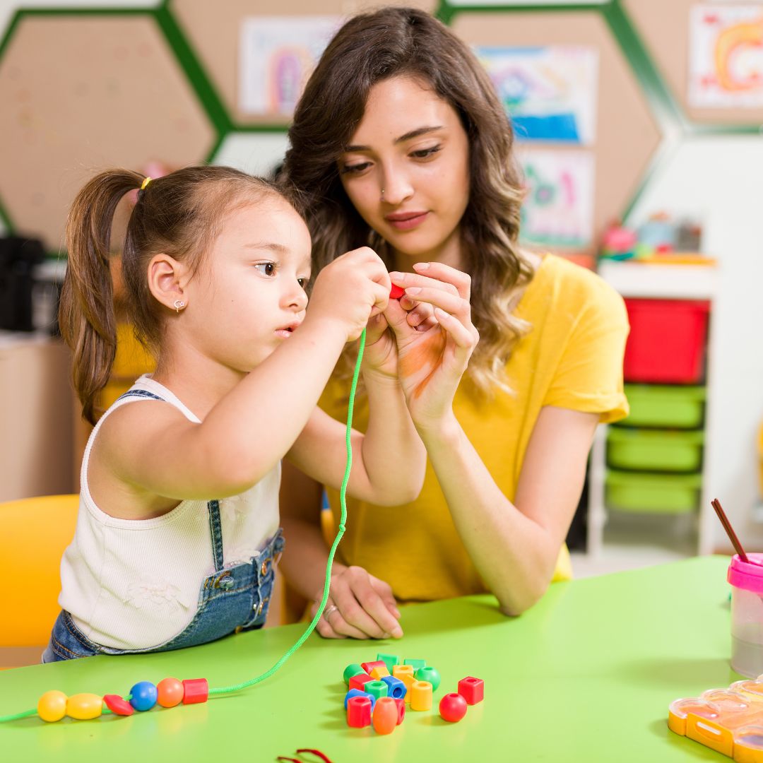 a teacher with a student, helping them