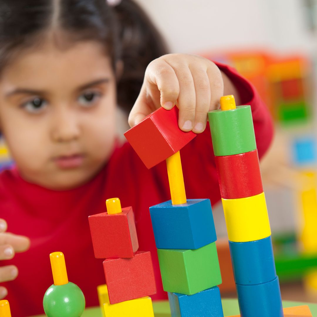 a student playing with blocks