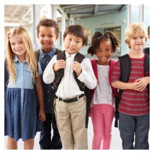Students smile outside school