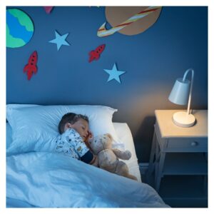 Young boy sleeps with night light