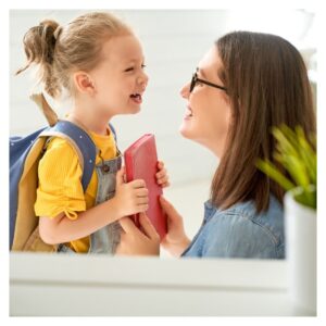 Mother and young daughter laugh
