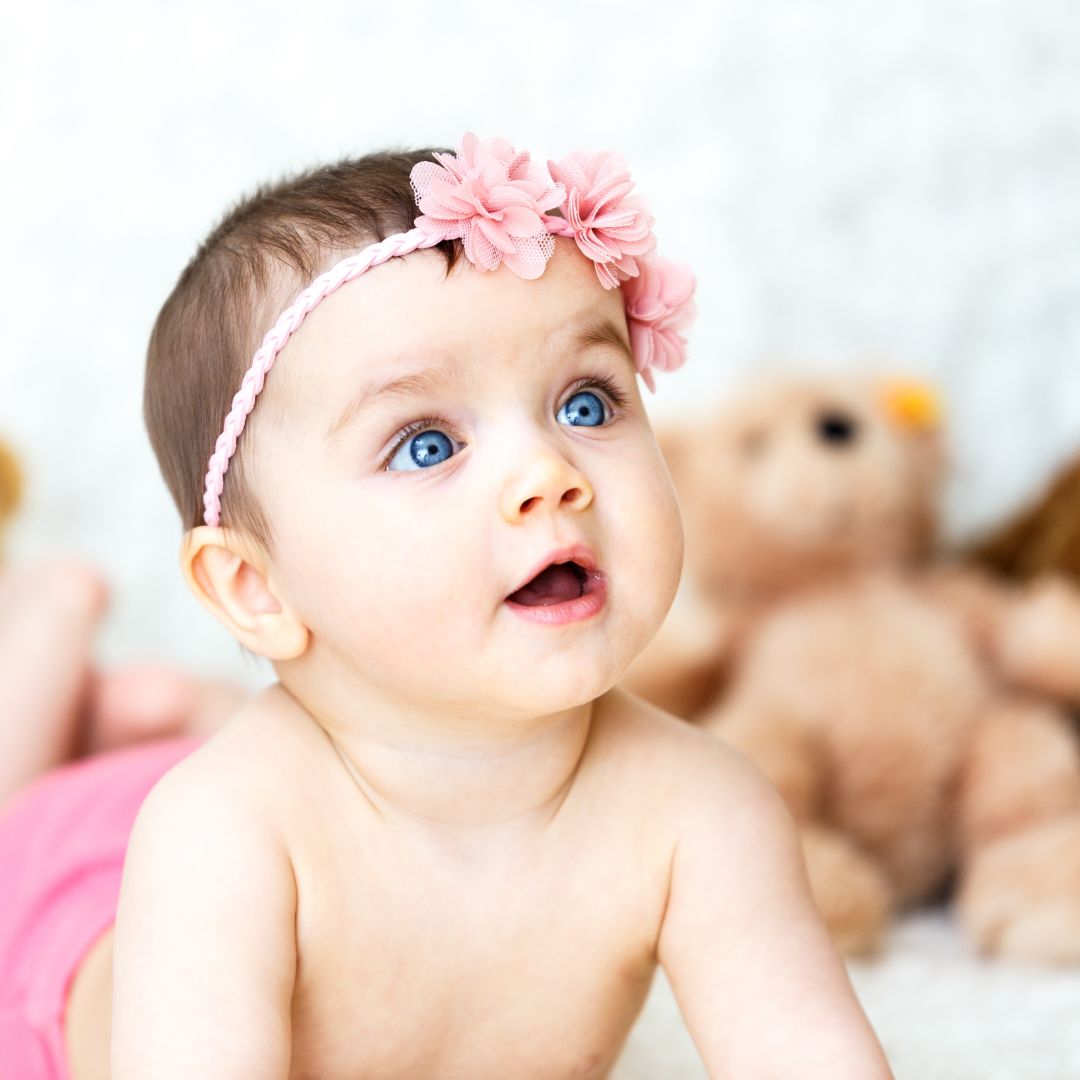 infant laying on ground