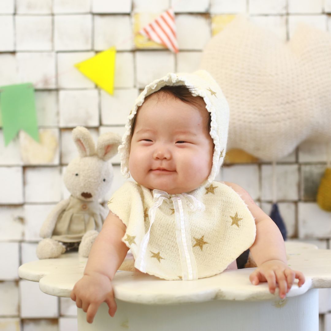 infant sitting at table