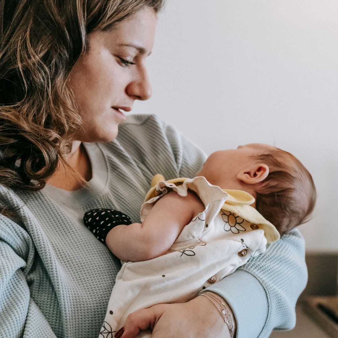 mom holding baby